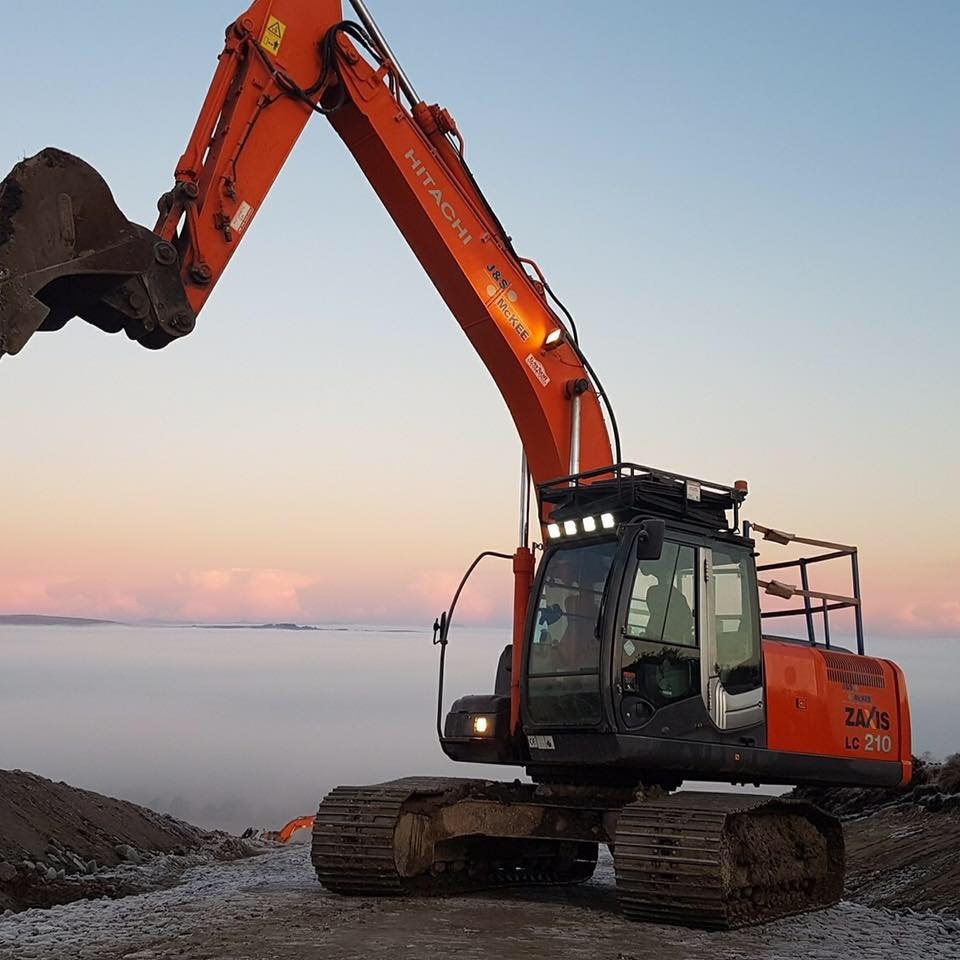 Hitachi 210 LC up above the clouds at windfarms