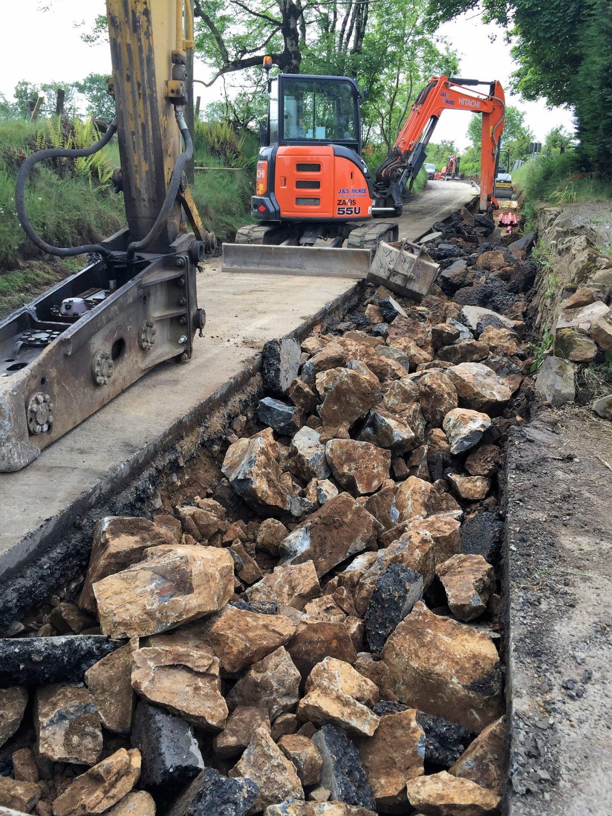 Breaking roadway for cable laying